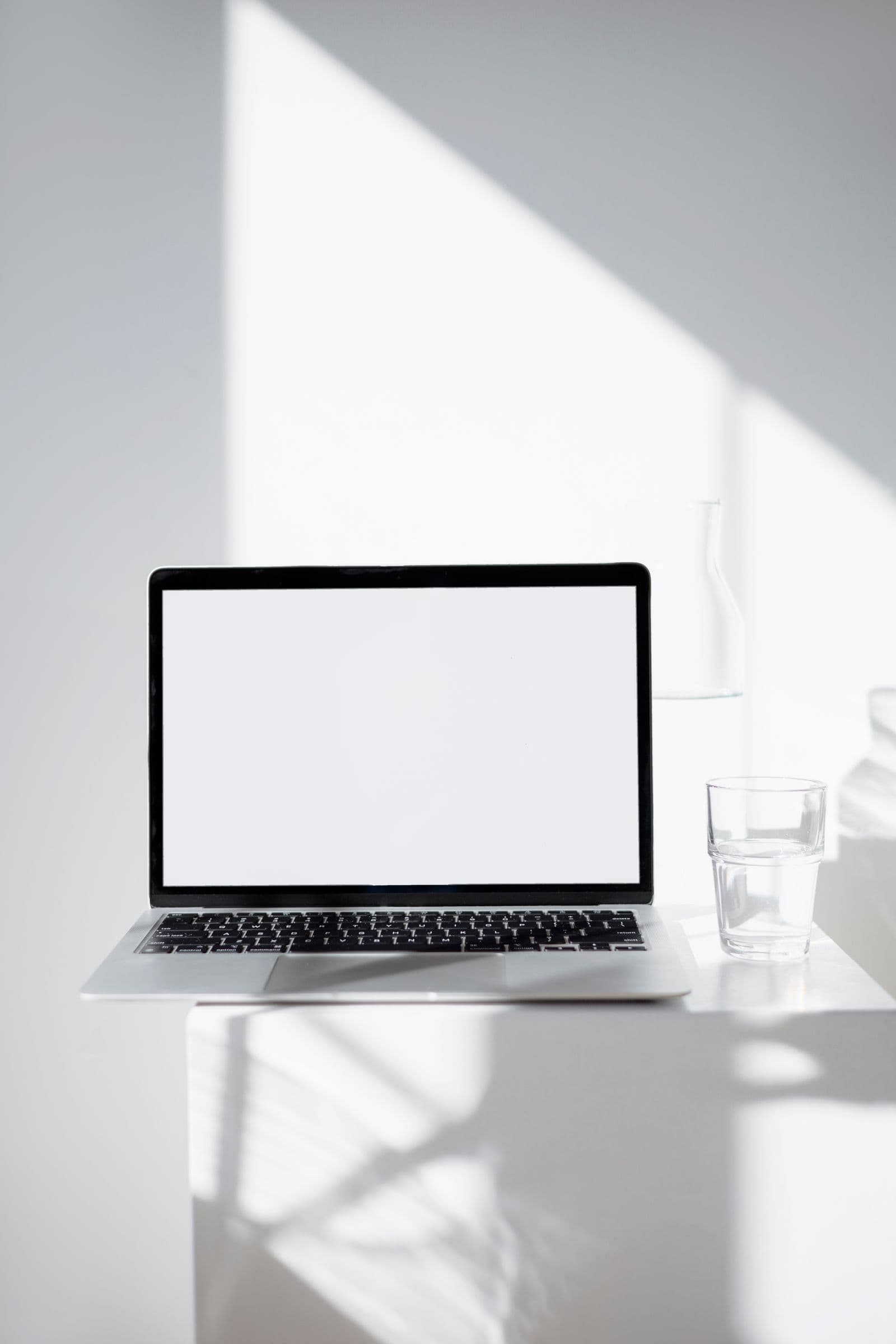 Minimal workspace with a laptop in natural light